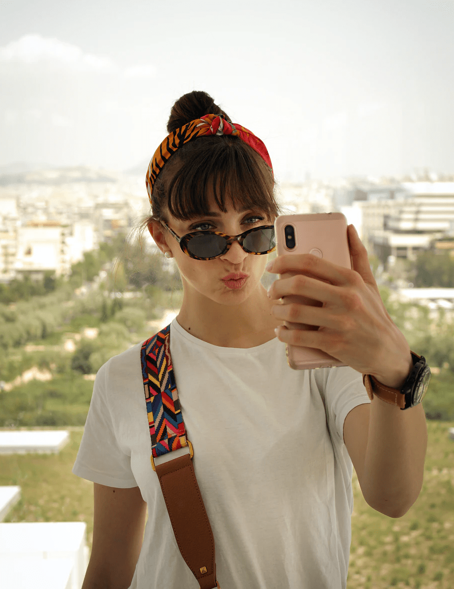 Portrait photo of a girl taking a selfie